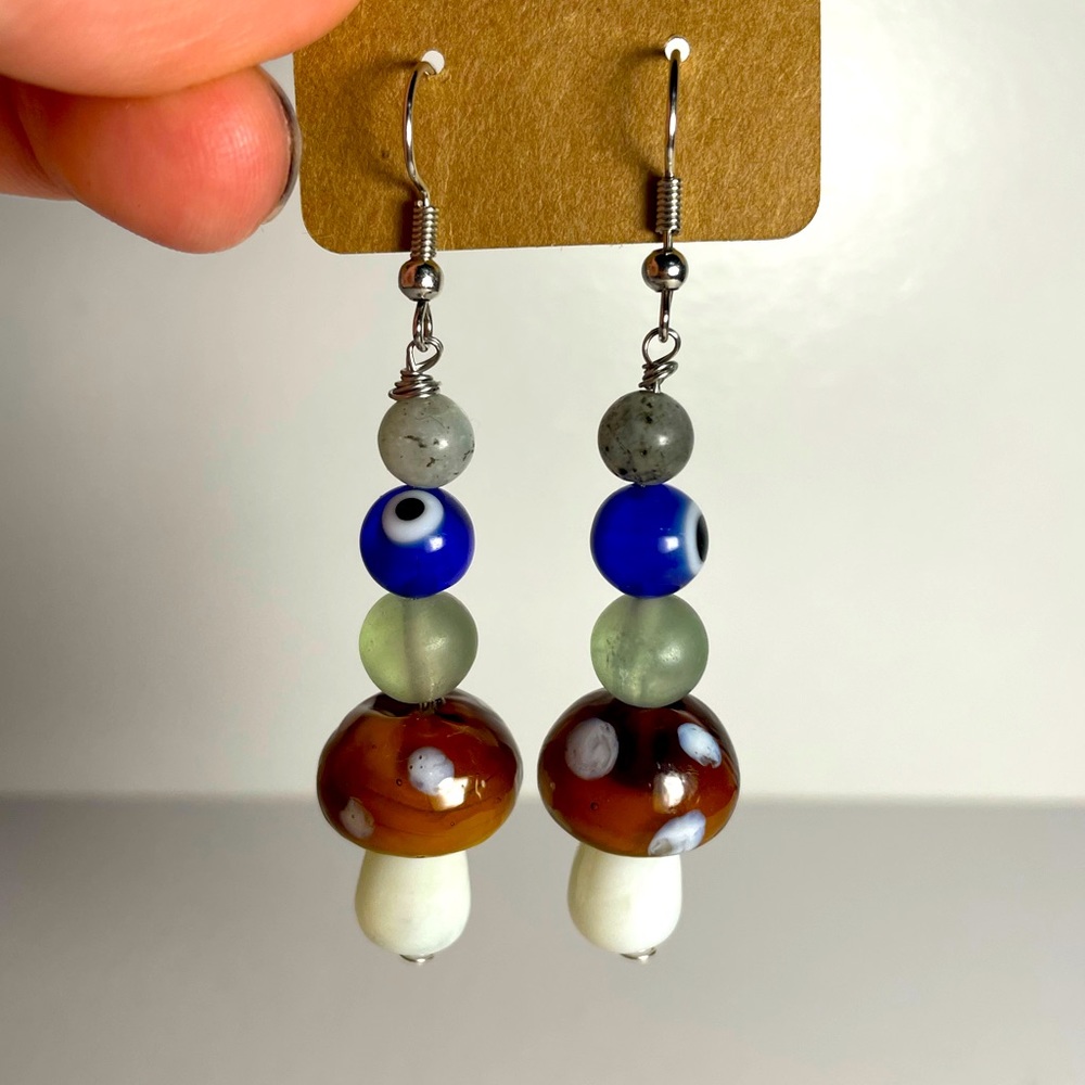 Evil eye mushroom earrings.
